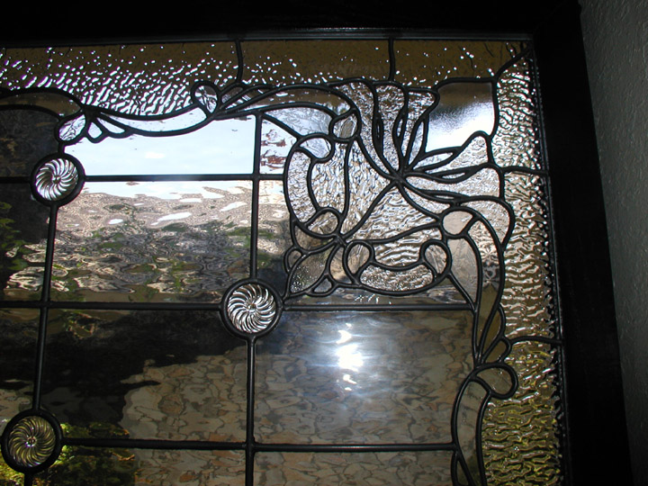 Custom leaded clear textured glass window set featuring a fluer di lis and victorian elements