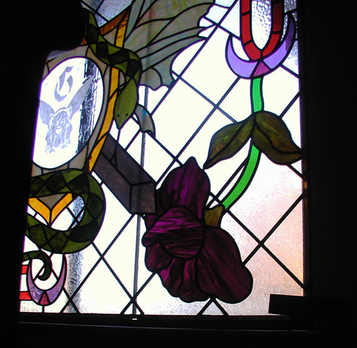 medieval style stained glass window with art nouveau elements