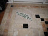 Custom fused glass and travertine floor.