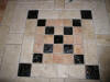 Custom fused glass and travertine floor.