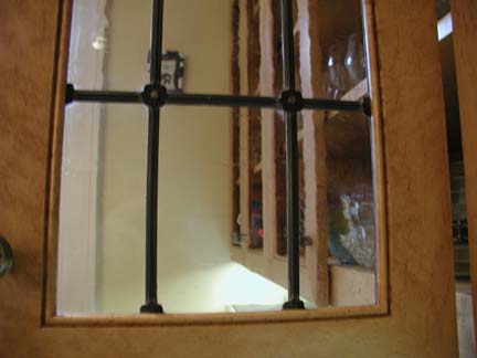 Leaded glass cabinet windows with rosettes