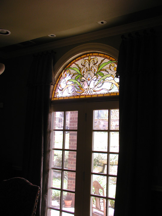 Leaded stained glass transoms in an Art Nouveau style