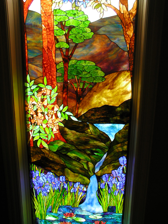 Stained glass landscape stairway landing window