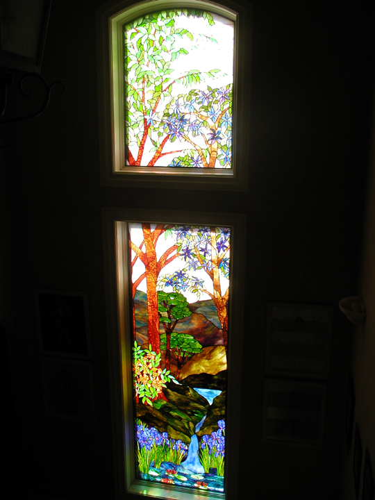 Stained glass landscape stairway landing window
