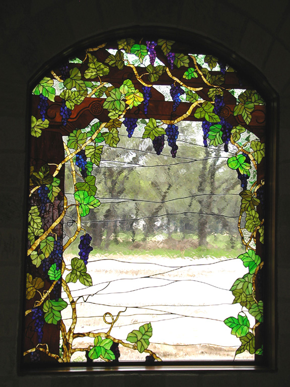 Grape vines on a trellis stained glass window