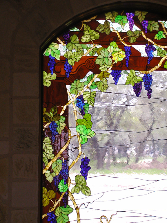 Grape vines on a trellis stained glass window