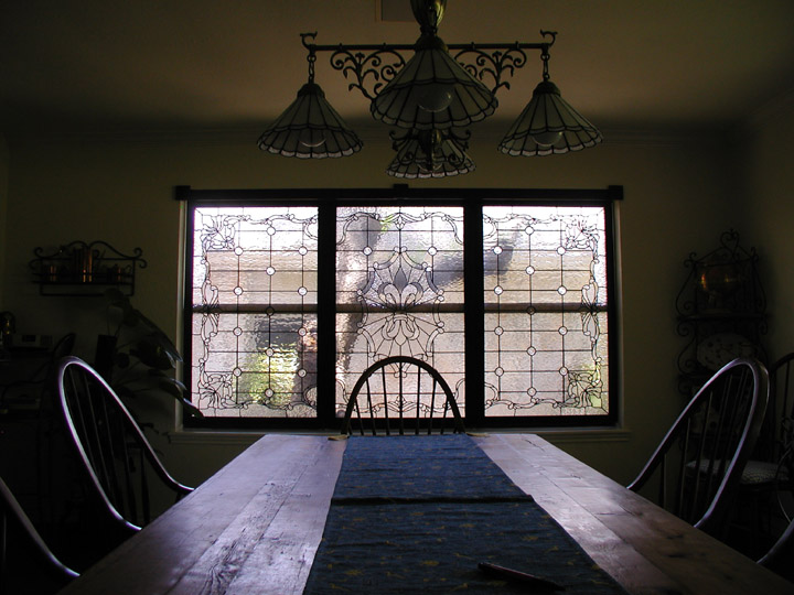 Custom leaded clear textured glass window set featuring a fluer di lis and victorian elements