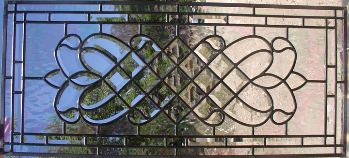 Leaded beveled glass window with iridescent water glass background