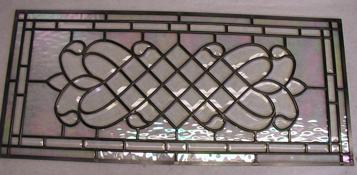 Leaded beveled glass window with iridescent water glass background
