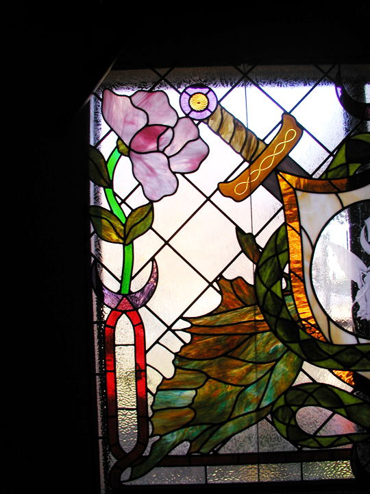 Medieval stained glass window with art nouveau elements