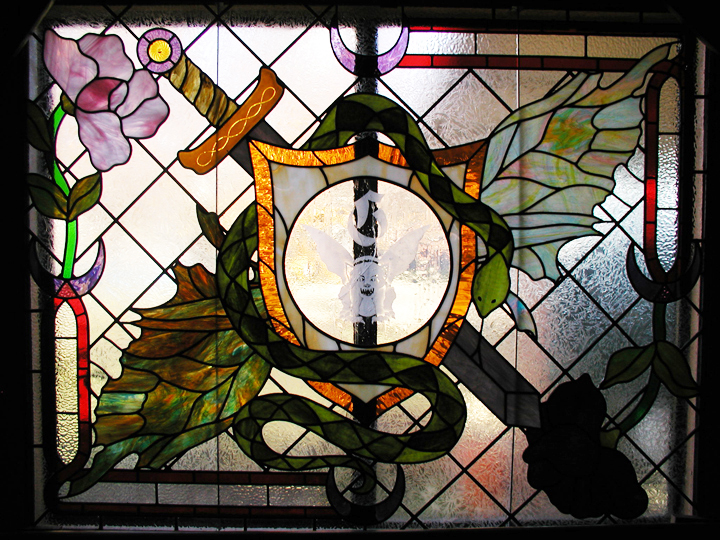 medieval style stained glass window with art nouveau elements