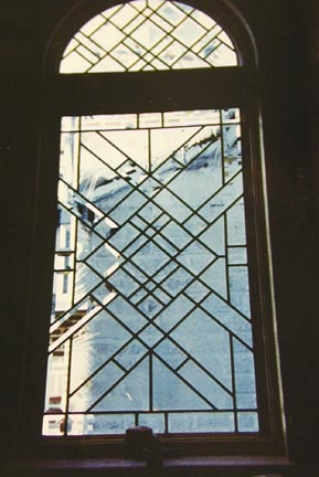Abstract leaded glass window with bevels