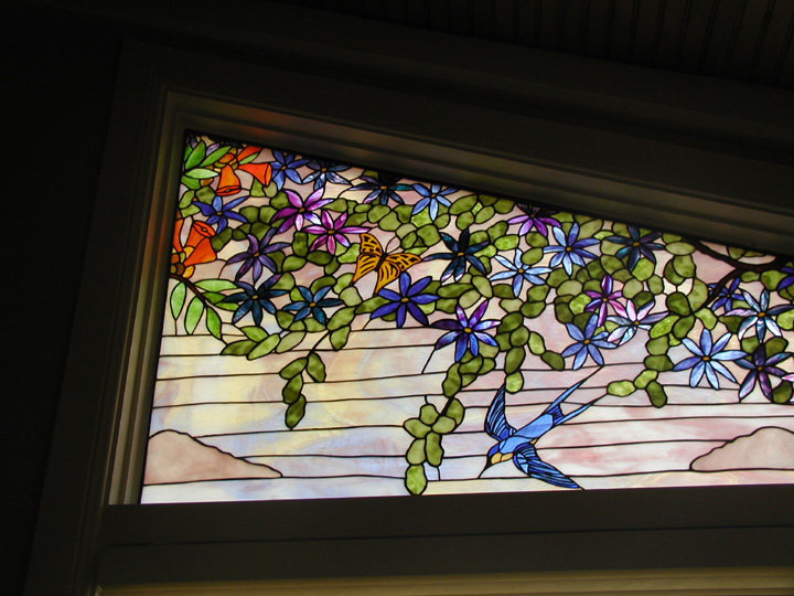 Clematis and trumpet vine stained glass window with birds and butterflies