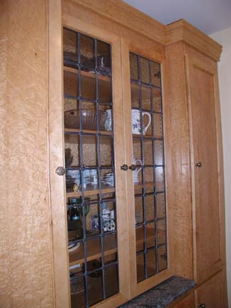 Leaded glass cabinet windows with rosettes