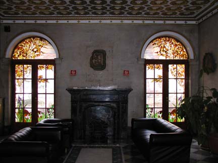 Stained glass scene in residential building lobby doors and transoms