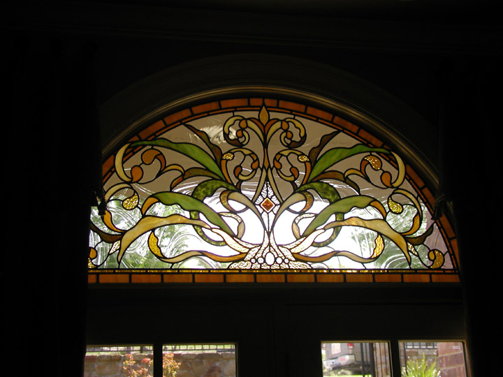 Leaded stained glass transoms with in an Art Nouveau style
