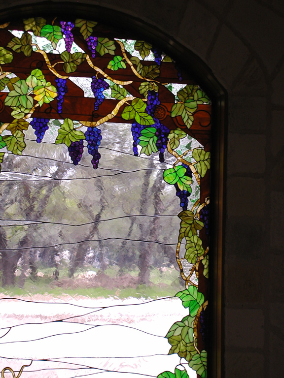 Grape vines on a trellis stained glass window