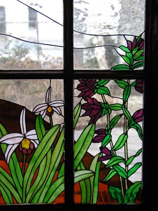 Stained glass scene in residential building lobby doors and transoms