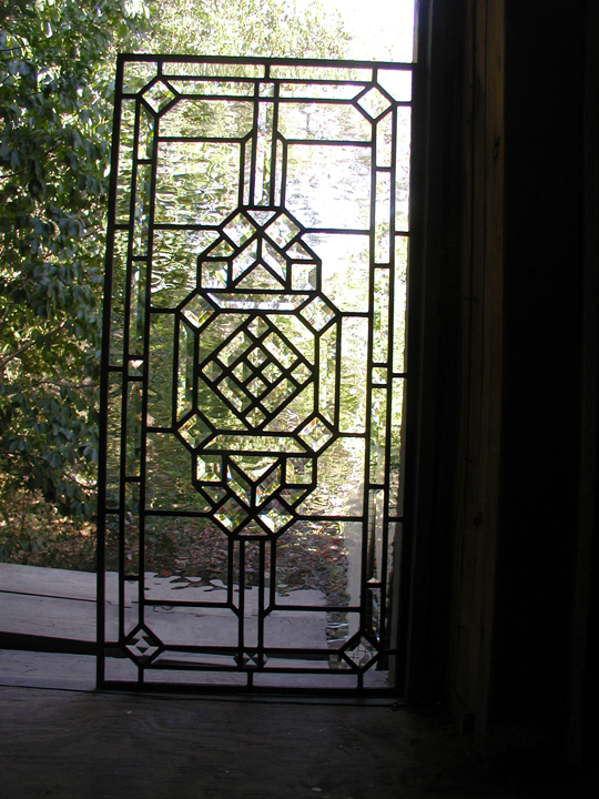 Leaded glass door panel incorporating bevels