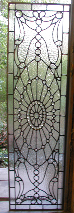 Leaded clear textured glass and jewels were used to create this bathroom privacy door panel. Brooklyn, New York approx. 15" x 58"