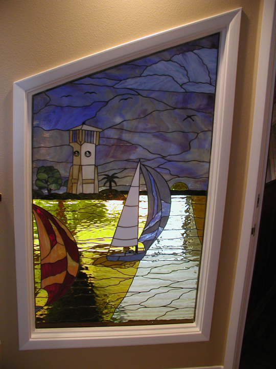 Stained Glass Scene with Lighthouse and Sailboats